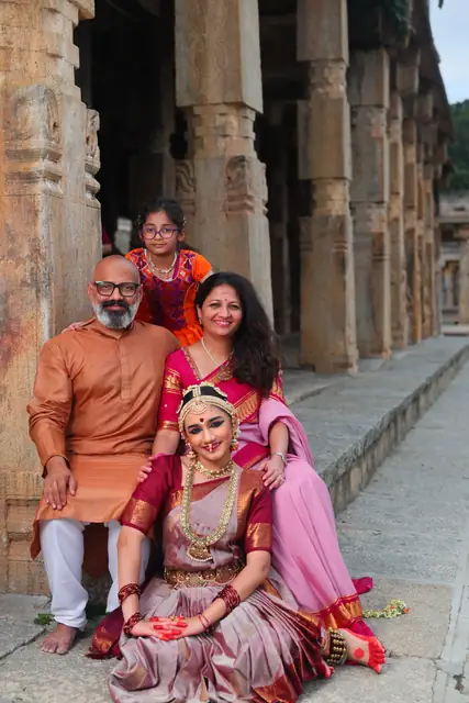 The family gathered close around Ananya