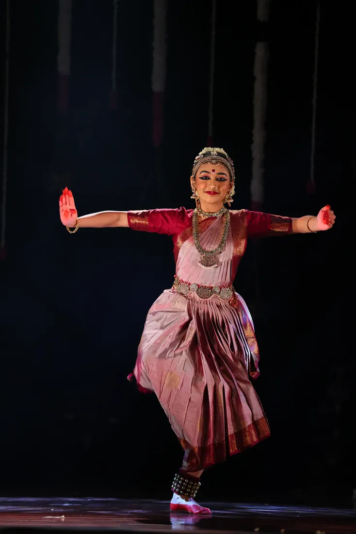 A graceful balanced pose during the Varnam