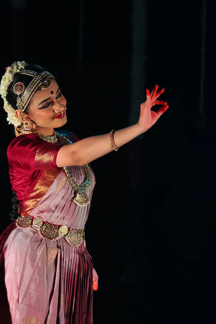 An expressive close-up amid stage smoke