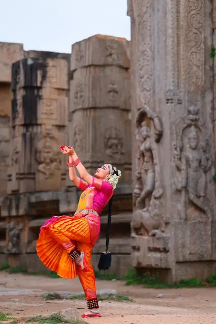 A dynamic leaping pose against ancient temple stone