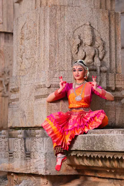 Seated mandala pose with a full flared costume