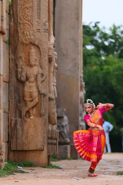 Dancing beneath a grand temple archway