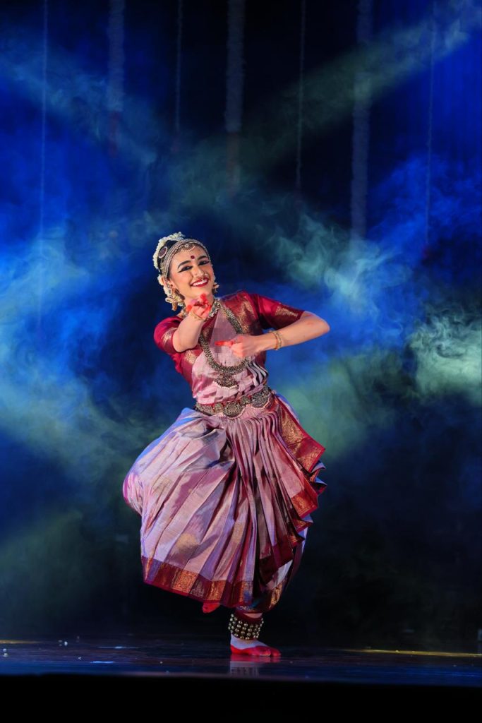 Ananya dancing amid blue theatrical haze
