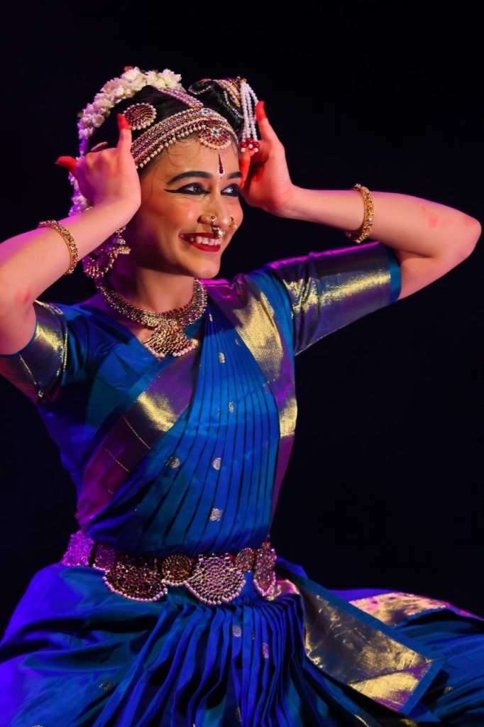 Ananya smiling while enacting a lively expression
