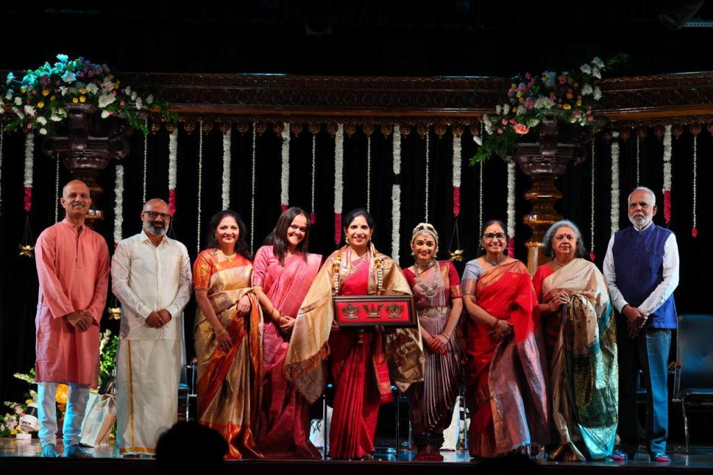 Ananya with her guru and guests on stage after the Rangapravesha
